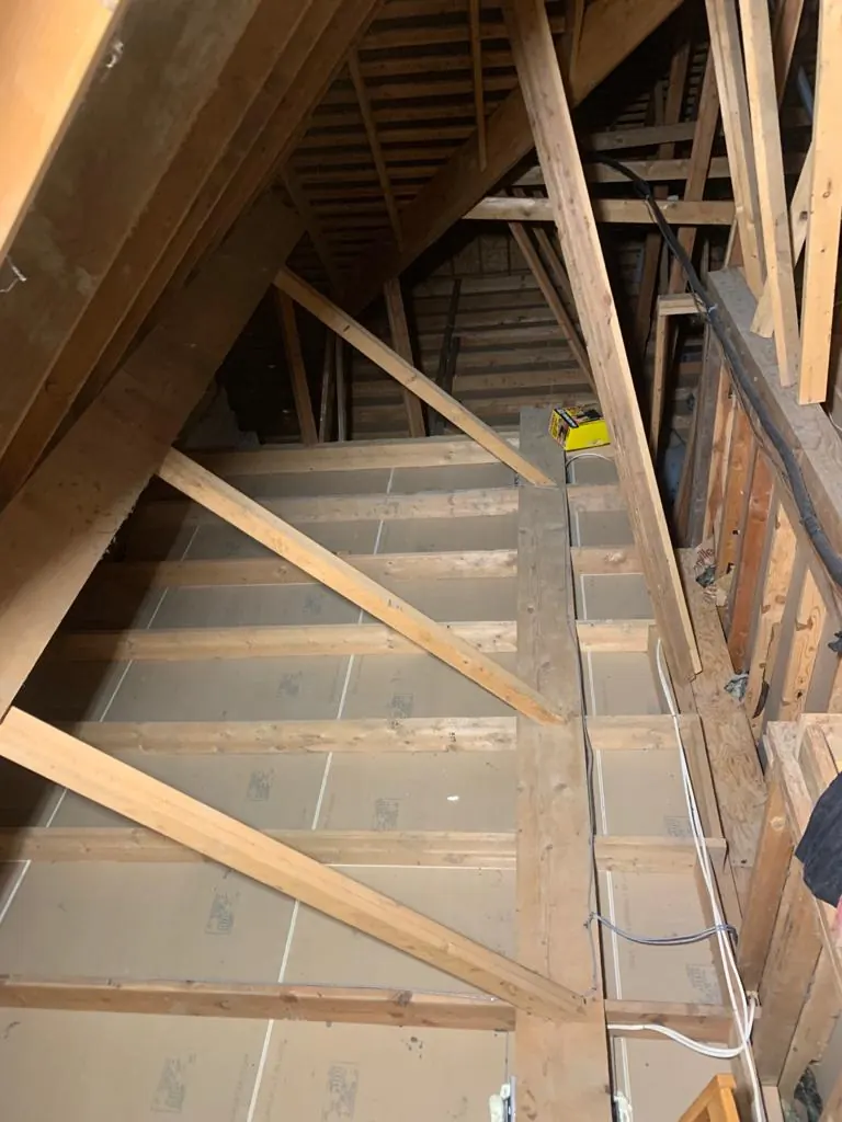 Vacuumed down to the ceiling drywall, ready for new insulation.