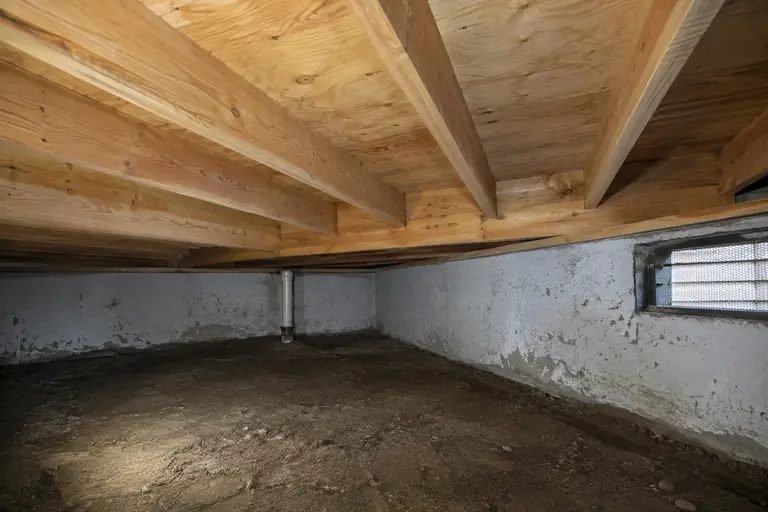 Mold remediation in Bellevue crawl space, after: Remediation complete: mold has been fully removed and the crawl space is clean and dry with visible, healthy wood surfaces.