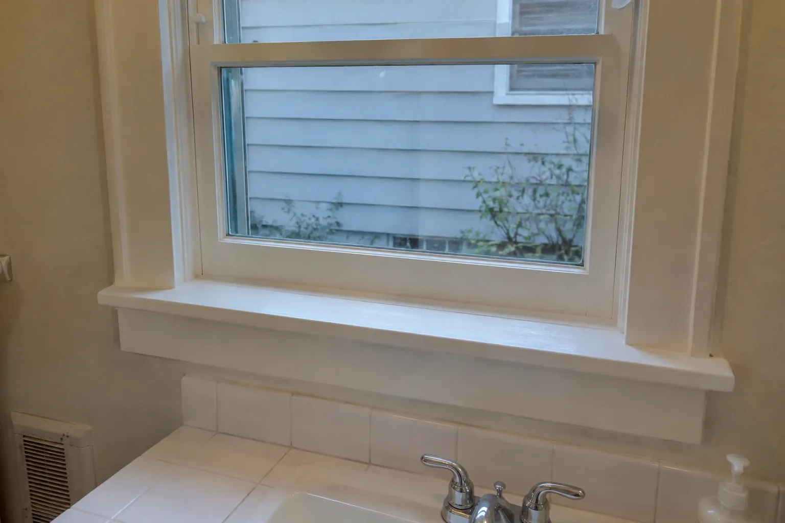 After: With window sill and frame fully cleaned and sealed, restoring a fresh and dry appearance.