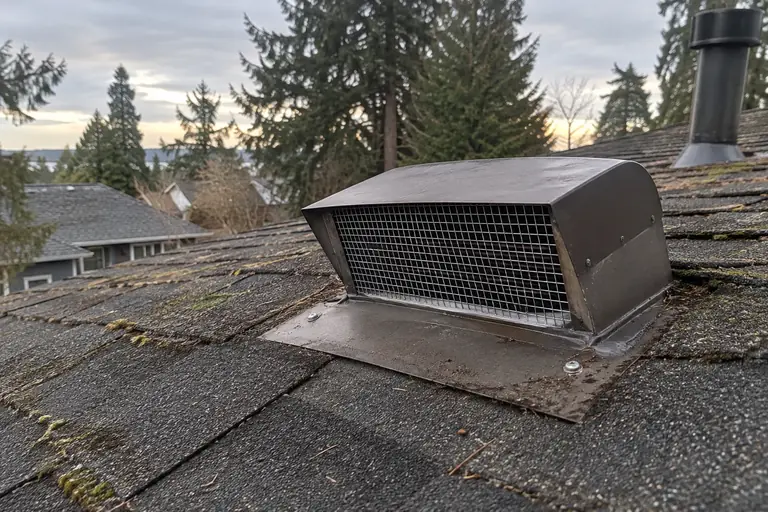 A roof vent fitted with a new steel mesh screen.