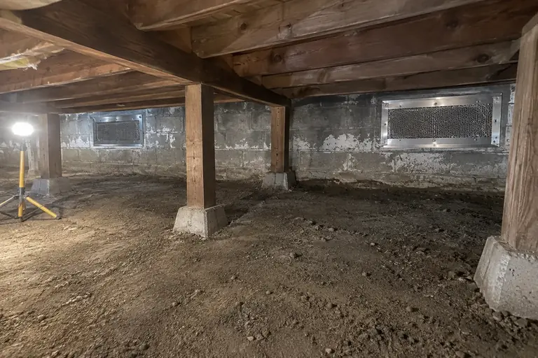 Crawl space rodent proofing in an Everett split-level, after: The foundation vents are securely sealed with steel mesh and metal flashing, eliminating rodent entry and signs of infestation.