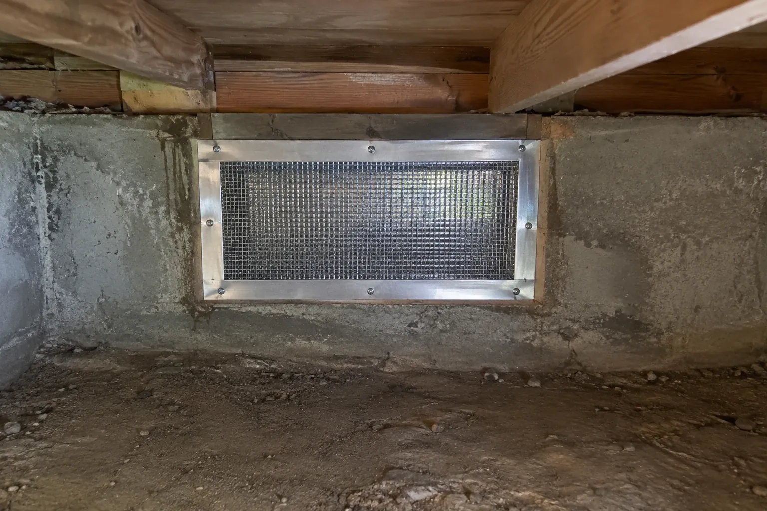 After: The crawl space vent is now fully rodent-proofed with a durable steel mesh and sealed frame, preventing any pest entry.