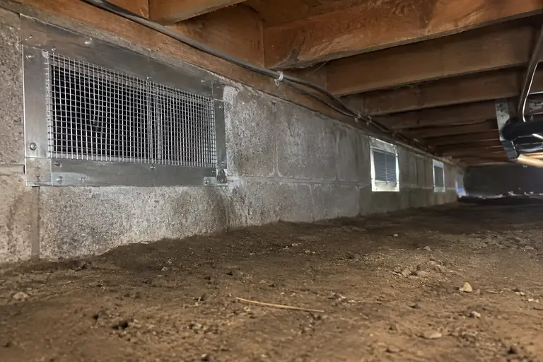 Crawl space vent sealing in Mount Vernon, after: Finished rodent-proofing seals all the crawl space vents with stainless steel mesh and sheet metal, preventing rodent entry.